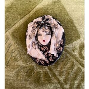 Elegant Black and White Cameo Brooch
